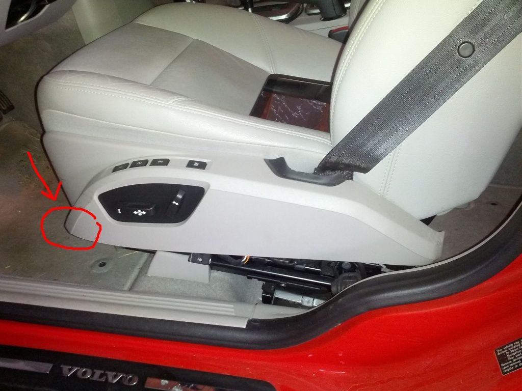 Step 2) Remove the screw that holds the seat control panel in place.